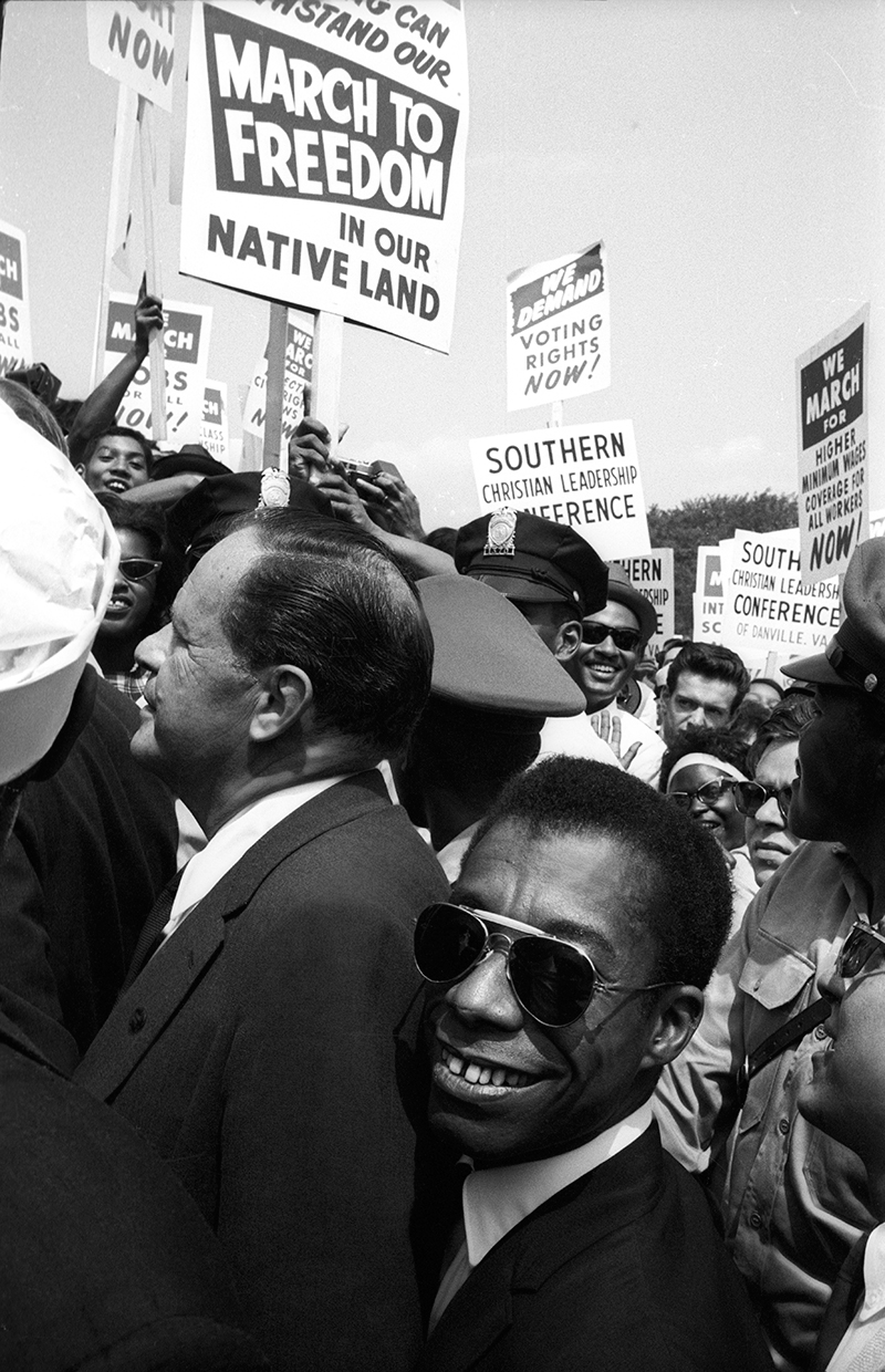 Joseph Mankiewicz and James Baldwin merging with the crowd - Dan Budnik all rights reserved