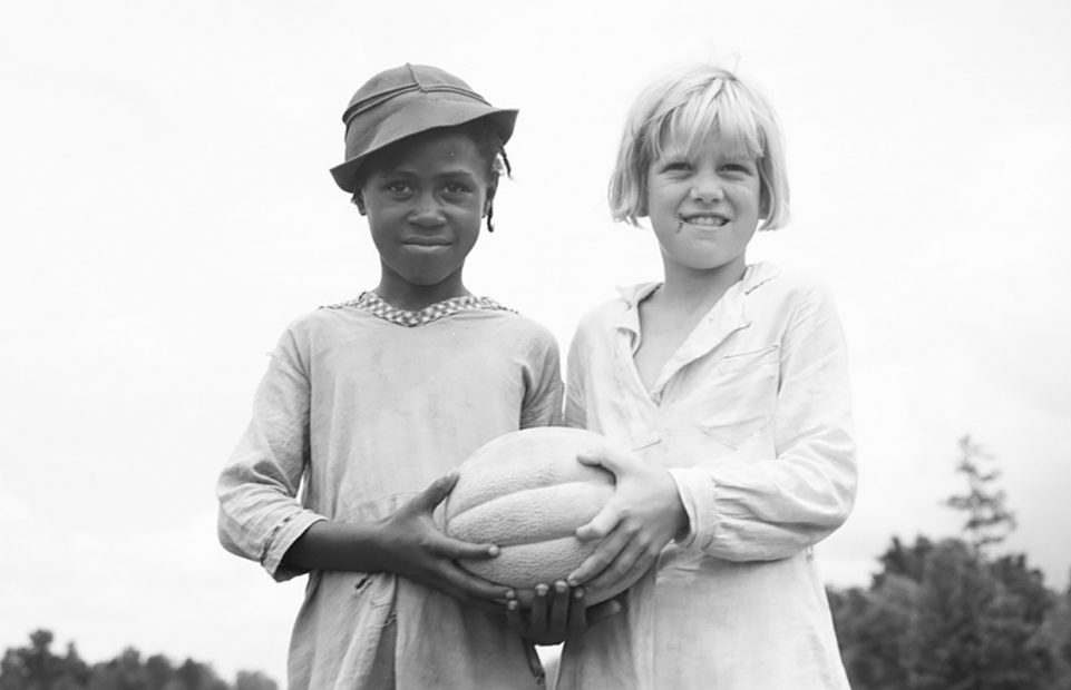 July 1936. Hillhouse, Mississippi. Girls with food for Fourth of July celebration at Delta Cooperative Farm settled by evicted sharecroppers from Arkansas