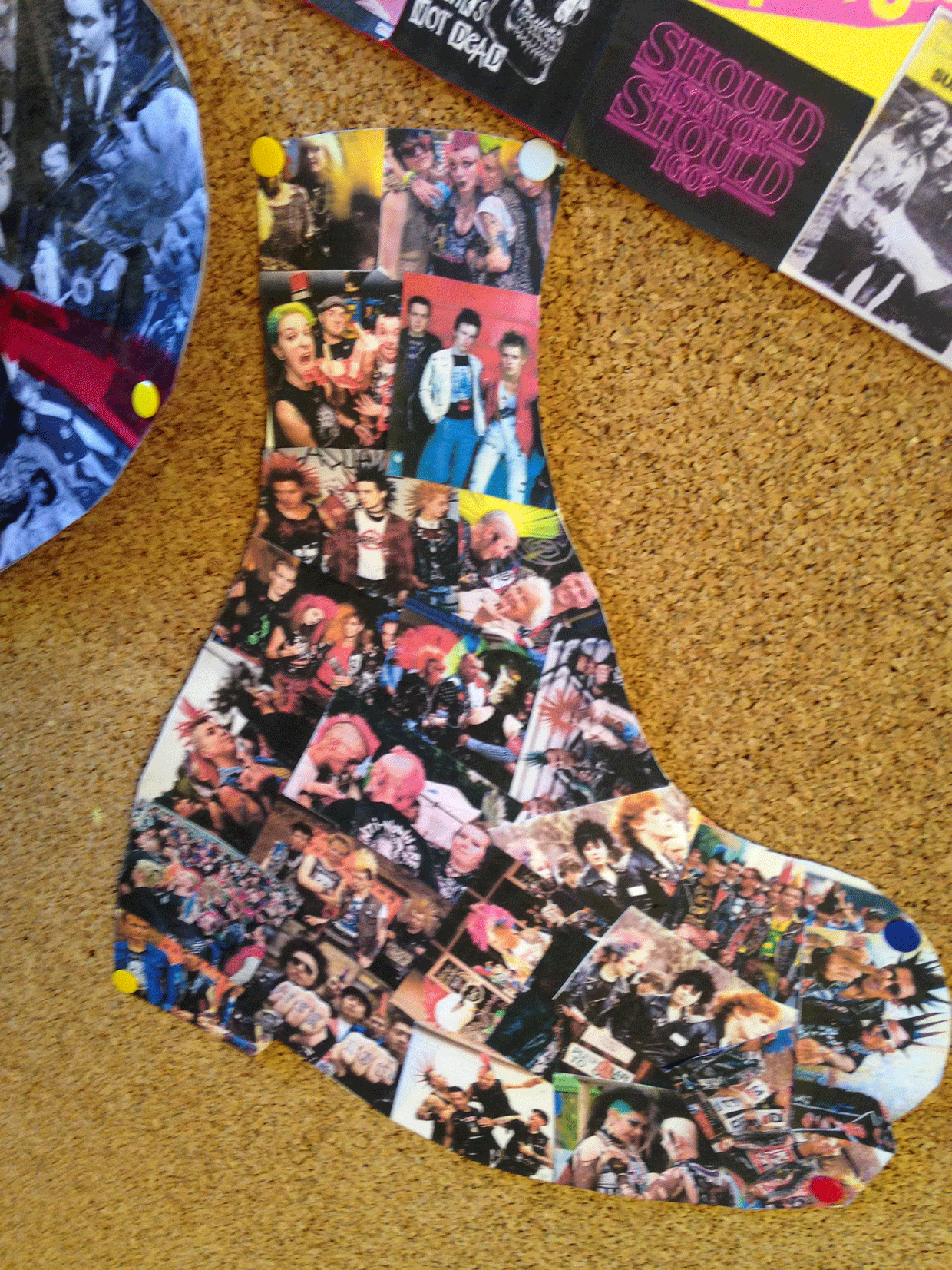 A punk collage in the shape of a boot.