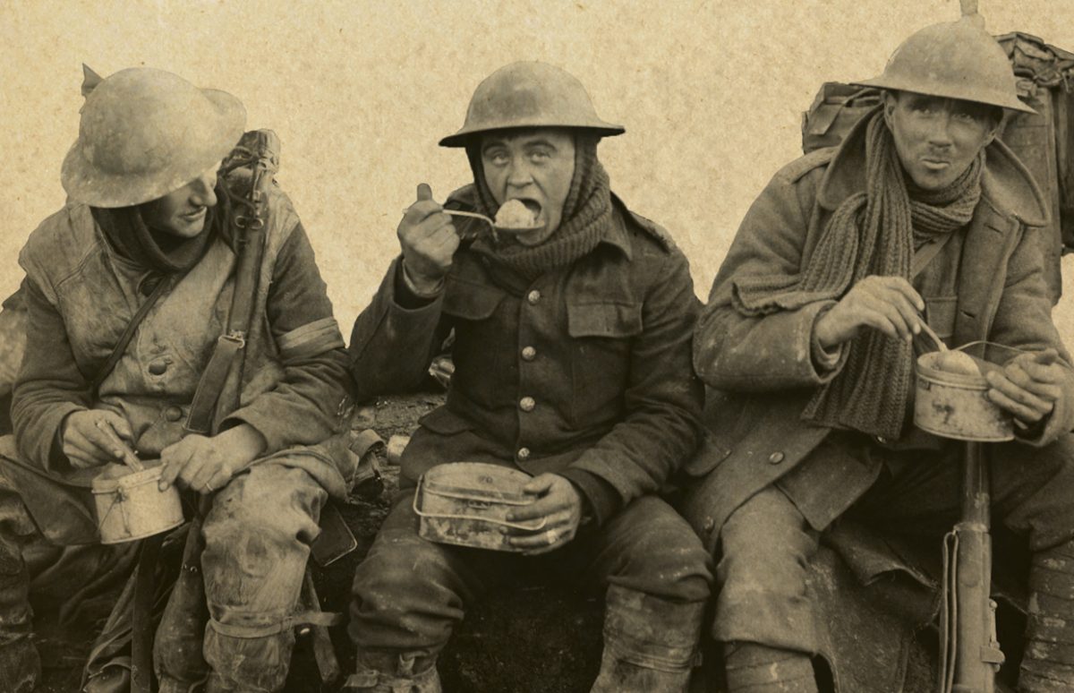 Soldiers in battle gear eating on the go.