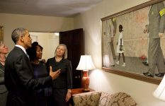 Former President Barack Obama at the White House with Ruby Bridges looking at Norman Rockwell's painting of her , The Problem We All Face.