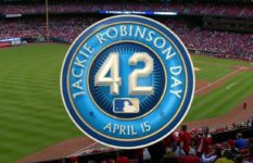 A baseball stadium with a logo in front saying Jackie Robinson Day April 15 42