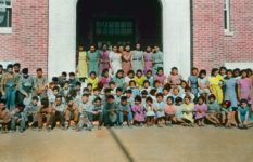 Pupils in front of Brandon Residential School, Manitoba, circa 1930