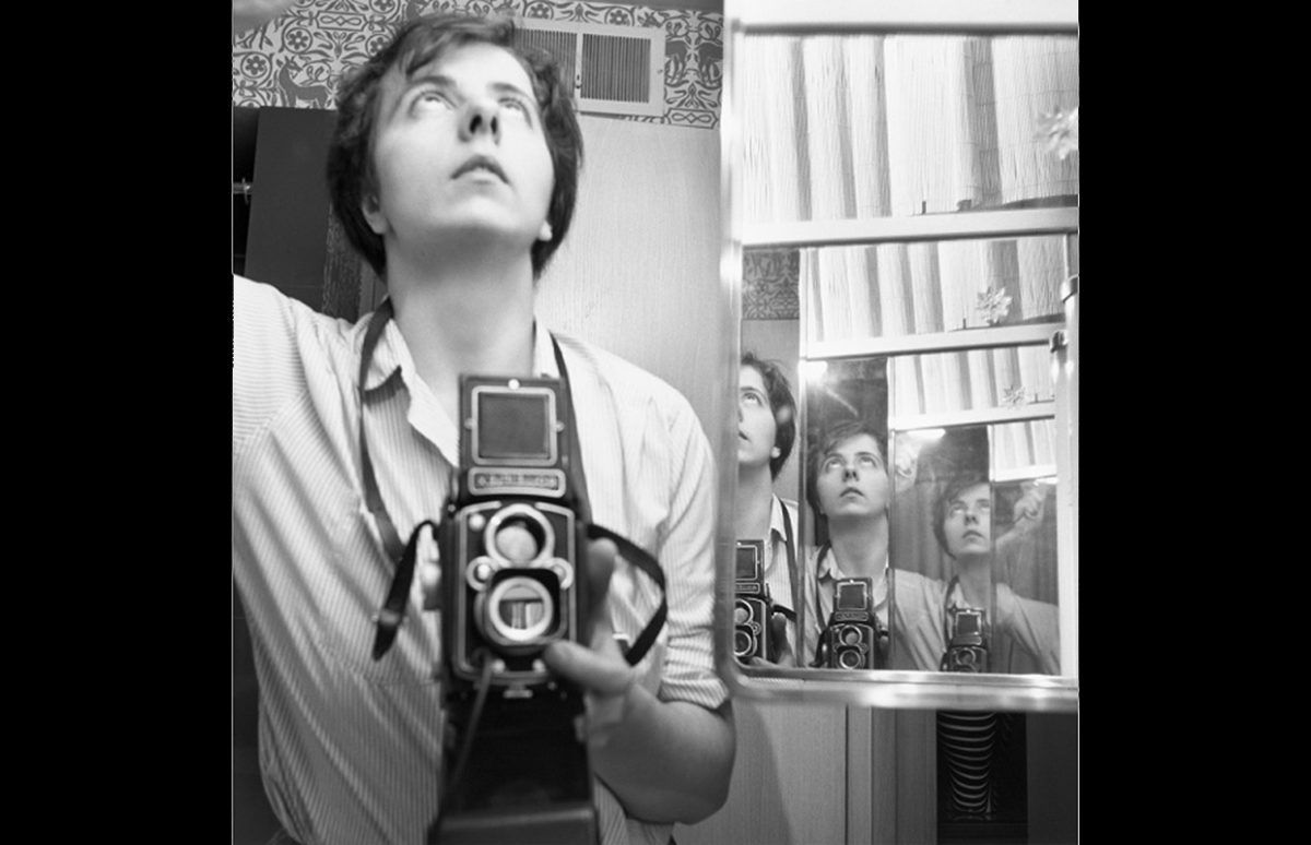 Vivian Maier self-portrait with reflections, holding her Rolleiflex camera, Chicago, 1956