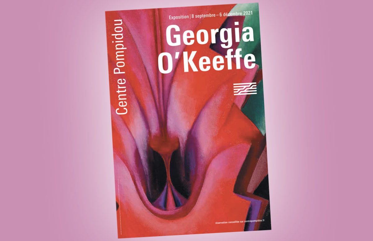 The exhibition poster features one of O'Keeffe's flower paintings, "Inside Red Canna", 1919