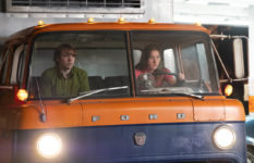 Cooper Hoffman as passenger and Alana Haim driving a truck in Licorice Pizza.