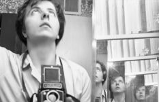 Vivian Maier self-portrait with reflections, holding her Rolleiflex camera, Chicago, 1956