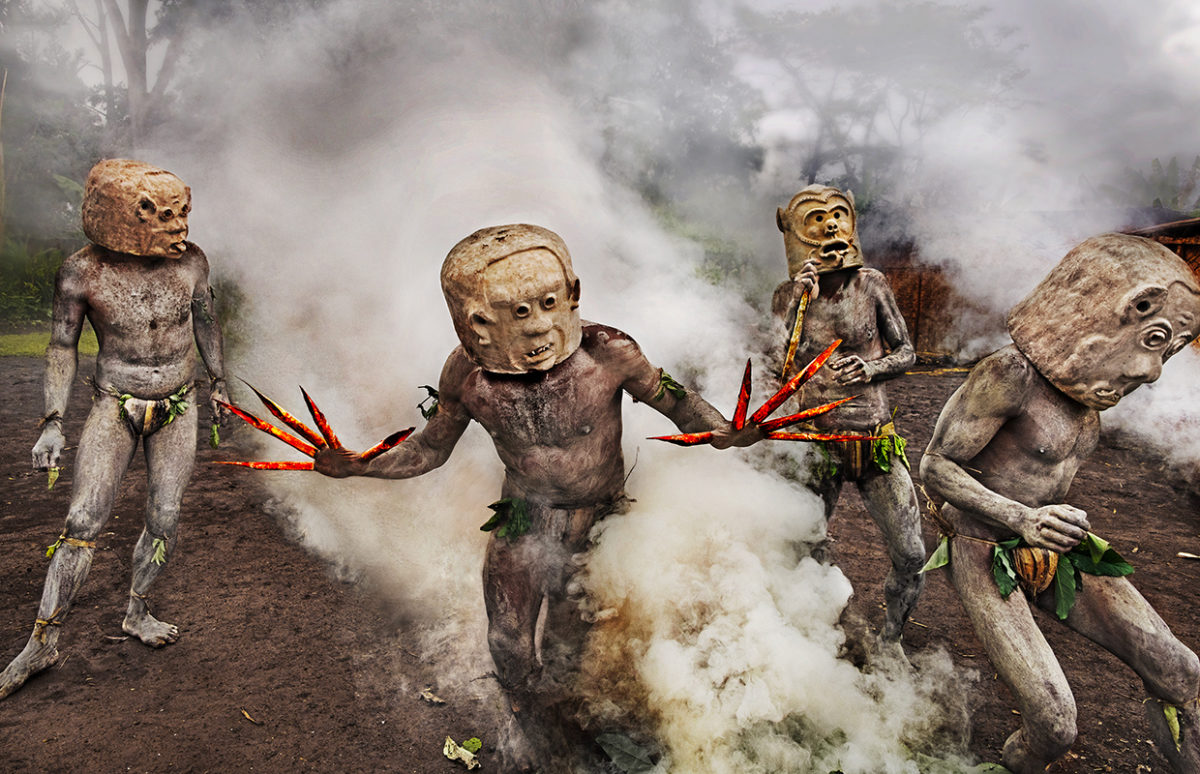 Papua New Guinea, 2017: men in masks performing a traditional dance