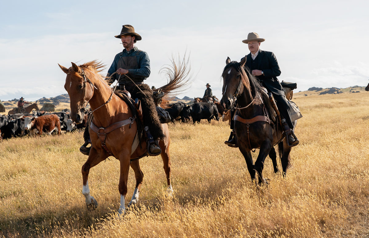 THE POWER OF THE DOG (L to R): BENEDICT CUMBERBATCH as PHIL BURBANK, JESSE PLEMONS as GEORGE BURBANK in THE POWER OF THE DOG. Cr. KIRSTY GRIFFIN/NETFLIX © 2021