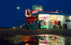 Poster announcing Festival America Littératures et cultures Amérique du nord 22 to 25 September 2022 over an image of a diner at twilight reflected in a puddle