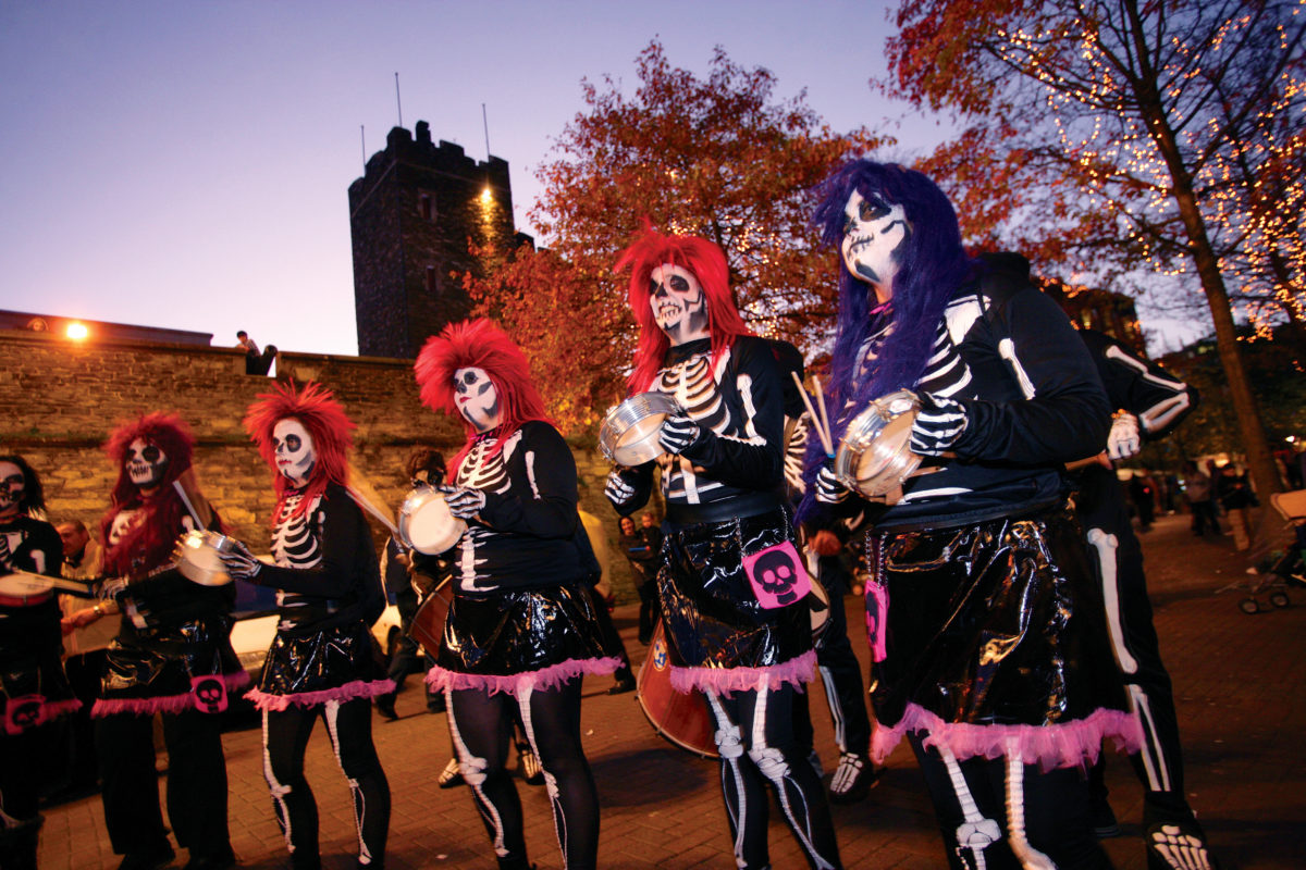 People in skeleton costumes in the Derry Londonderry Halloween parade