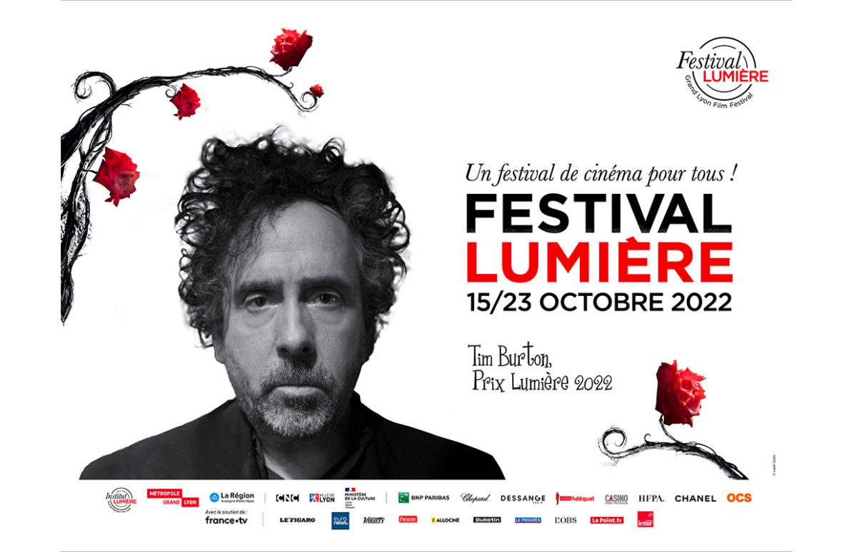 A poster announcing the Festival Lumière with a photo of Tim Burton.