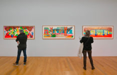 Visitors viewing Hockney paintings.