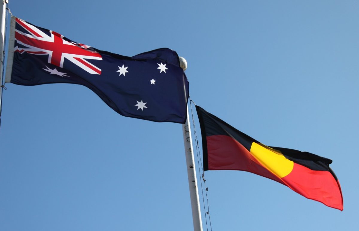 An Australian and an First Nations flag flying in the Australian capital Canberra.