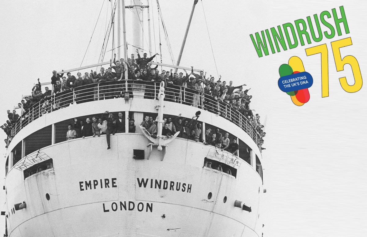 Passengers waving from the Windrush as it docked in England, with the Windrush 75 logo.