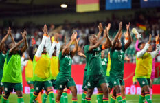 The Zambian team celebrates making it into the World Cup for the first time.
