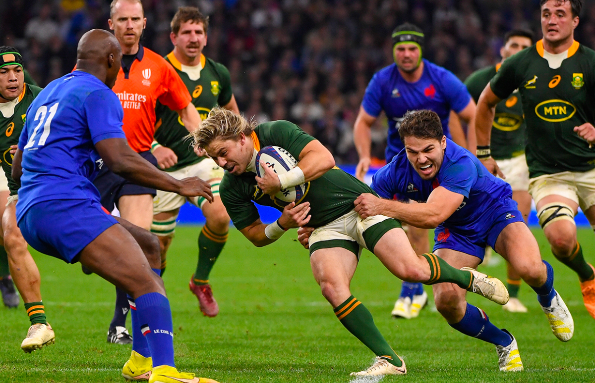 To win, France have to beat the current champions South Africa, as they did in this match in Marseille on 12 November, 2022. In the photo, South African scrum half (number 9) François “Faf” de Klerk is seen being tackled by French scrum half and captain Antoine Dupont. In the background in orange is the match referee, Wayne Barnes from England.