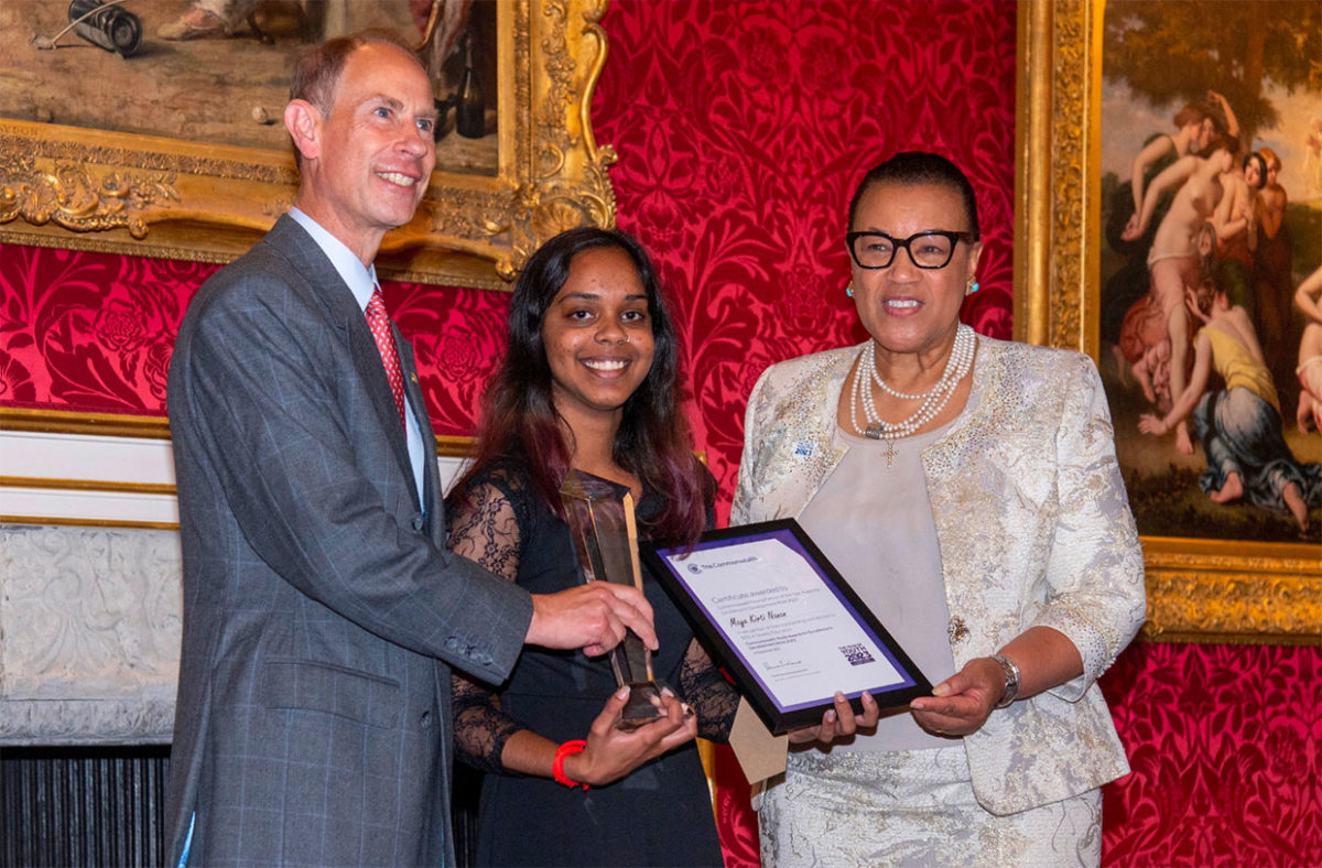 Maya Kirti Nanan from Trinidad and Tobago, receives the Commonwealth Young Person of the Year Award from Price Andrew.
