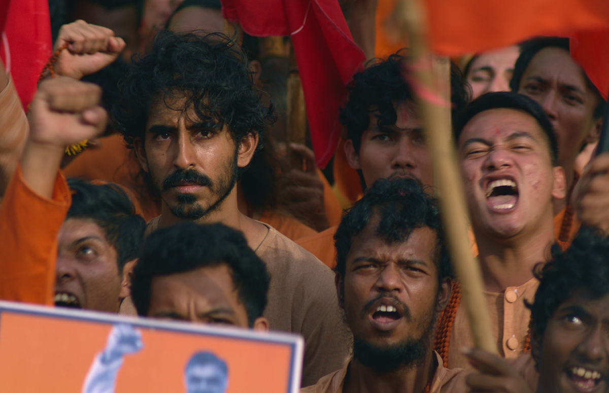 Dev Patel, back left, as the Kid in Monkey Man.