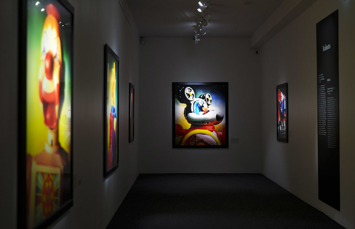 A view of the exhibition with a Mickey-Mouse-type image at centre.