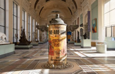 A giant spray can with wings, looking well-used, called We-Are-Here. In a gallery of traditional sculpture.