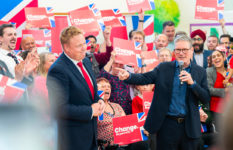 Keir Starmer, right, during the campaign, with Chris Bloore, Labour’s candidate for Redditch, and a croud of people holding signs with the slogan Change.