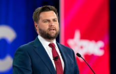 A portrait of J.D. Vance against a red, white and blue background.