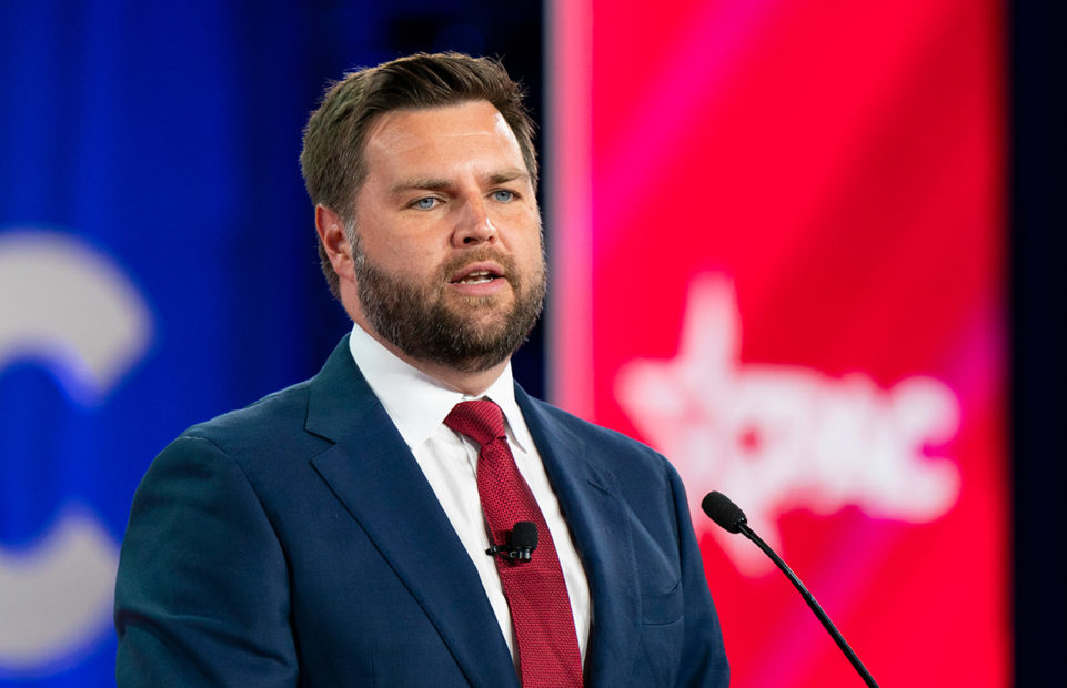 A portrait of J.D. Vance against a red, white and blue background.