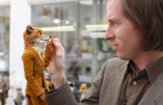 Wes Anderson with the figurine of Fantastic Mr Fox.