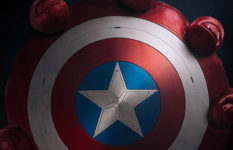 Captain America's shield in a red hand