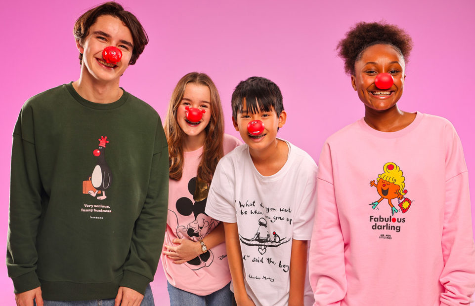Four teenagers wearing Comic Relief Red Noses and REd Nose Day T-shirts.