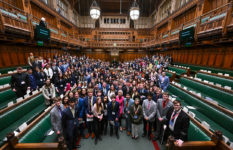 A group photo of the Members of the Youth Parliament in the House of Commons chamber.