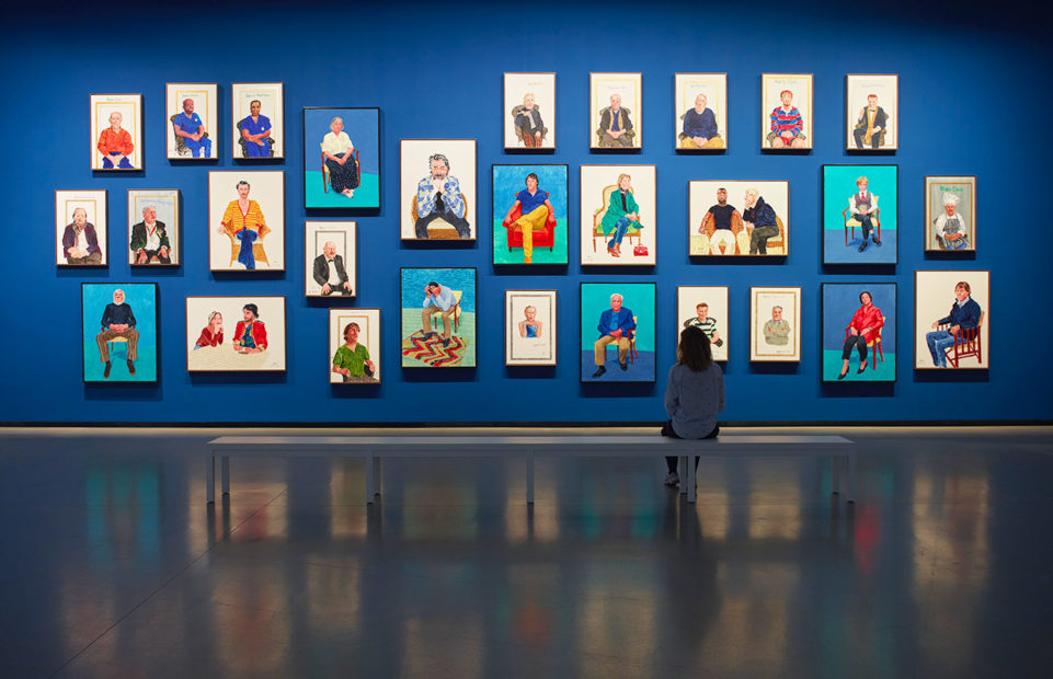 A display of portraits in Hockney's exhibition.