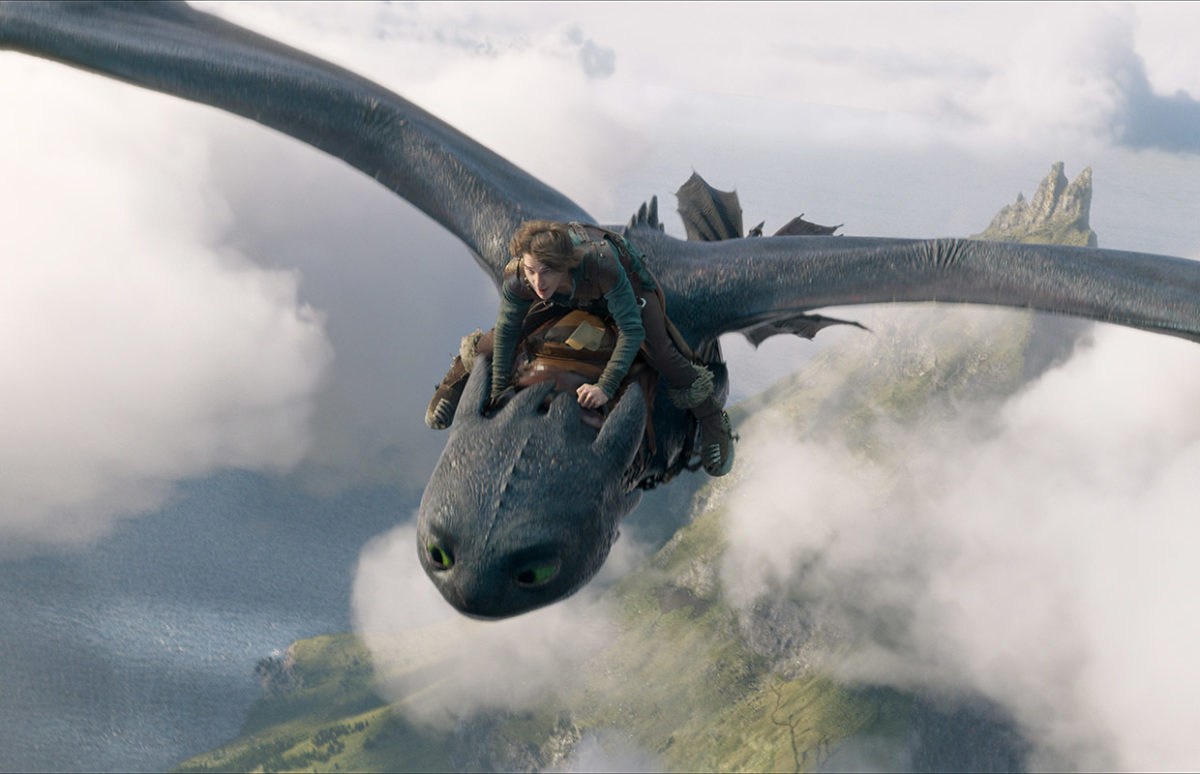 The character Hiccup riding on his dragon.
