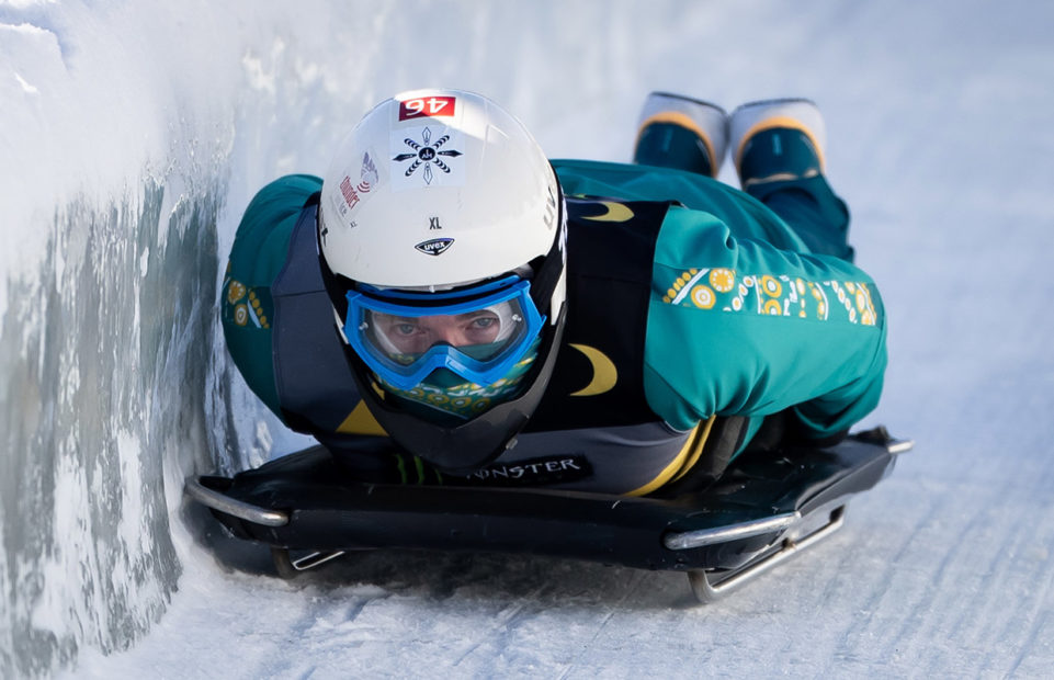 A person doing skeleton bobsledding.