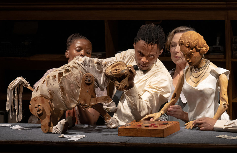 Actors interact with puppets of both humans and animals in Faustus in Africa.