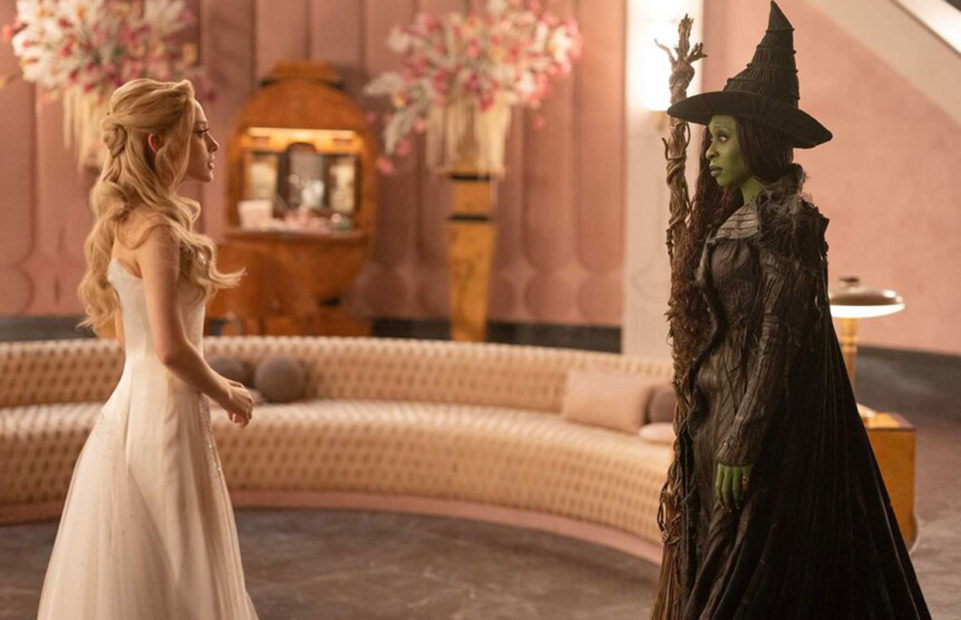 Glinda and Elphaba in a bedroom.